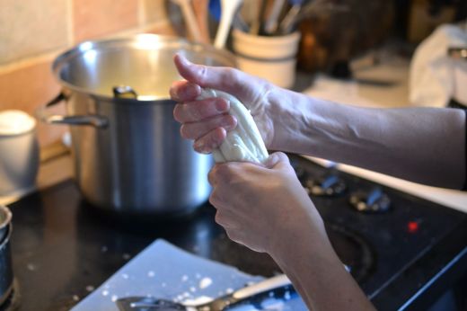 Amy making mozzarella cheese from our goat's milk